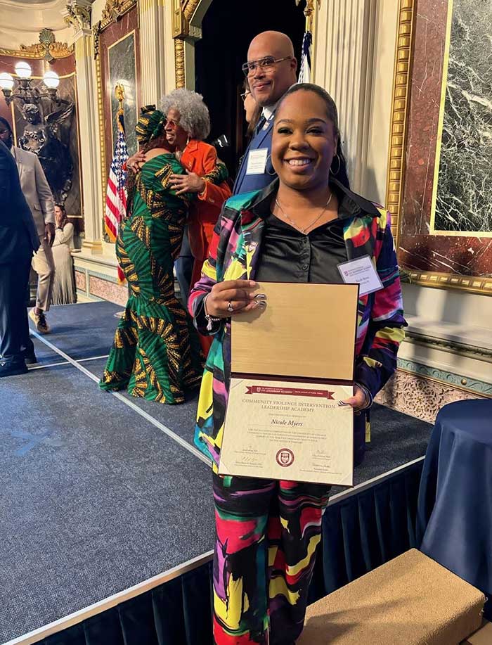 SAVE's Nicole Myers poses with her diploma