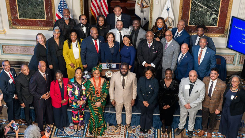 Nicole Myers poses with Vice President Kamala Harris and other violence prevention leaders